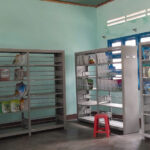 mpty bookshelves in a rural school library in Vietnam, showing severe shortage of age-appropriate reading materials